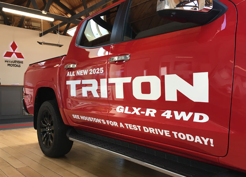 Red Triton ute — custom signage